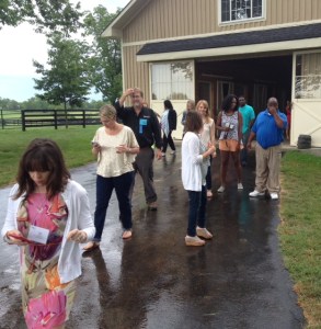 Shaun (in blue) answers questions as visitors emerged from a horse barn.